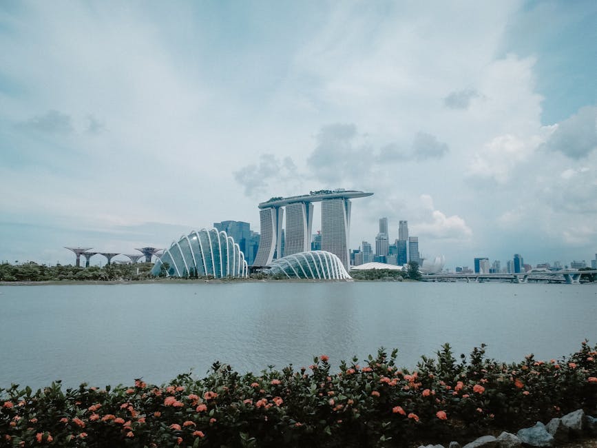 Iconic Marina Bay Sands with city skyline and Gardens by the Bay, Singapore.