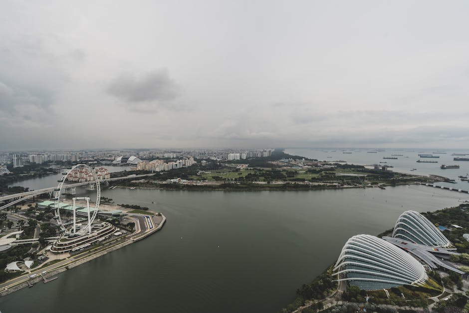 Stunning aerial shot of iconic Singapore skyline with harbor and gardens.