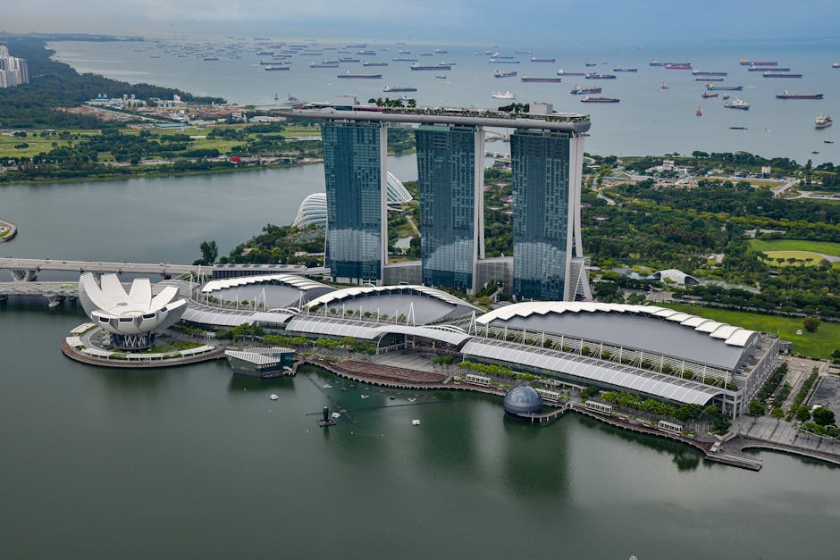 Stunning aerial shot of Marina Bay Sands and the Singapore skyline by the waterfront.